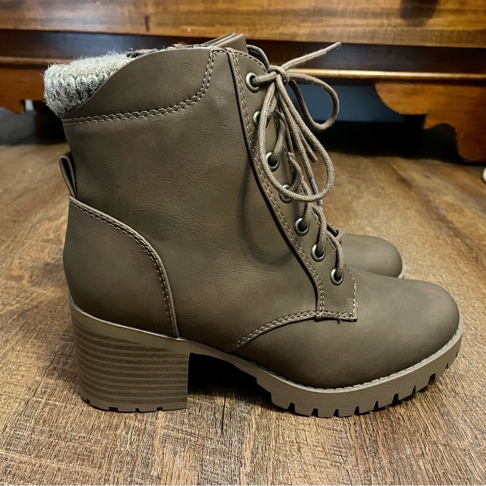 Brown heeled booties with fabric detail on back